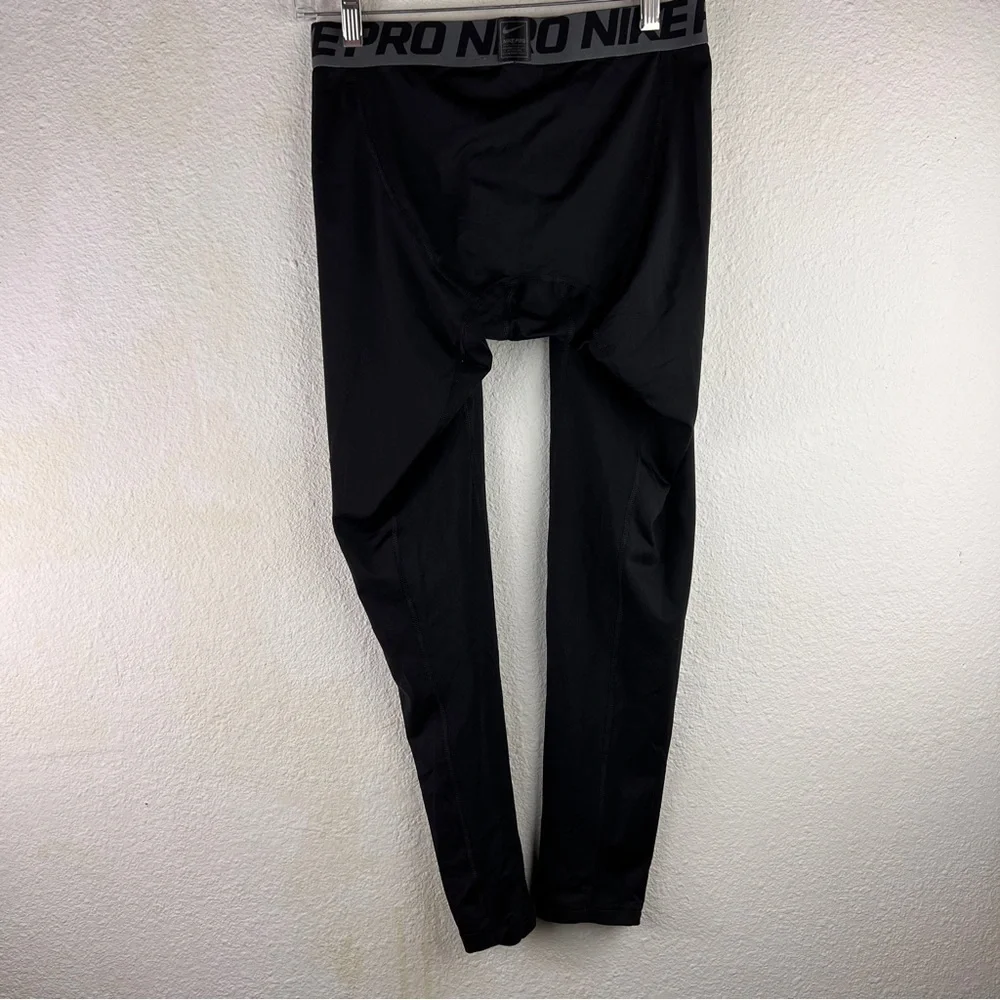 NIKE PRO TRAINING TIGHTS. Size XL. Black w/gray elastic band waistband. No snags